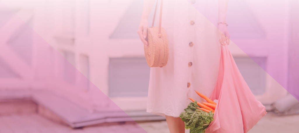 Eco Friendly gift ideas. A Woman carrying vegetables in a eco-bag.