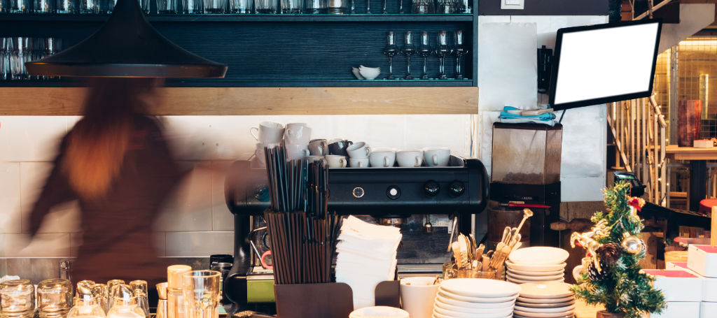 Could Açaí help your business to grow? Image of a woman preparing some food in a café