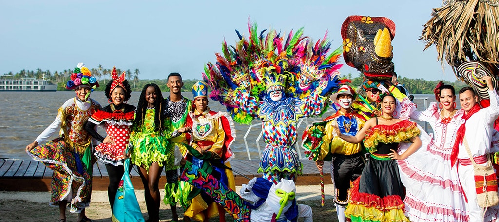 People dressed up for carnival posing for a photo
