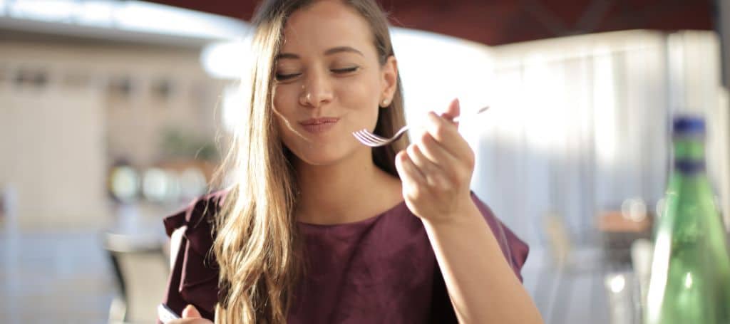 photo of woman eating healthy food, and happy